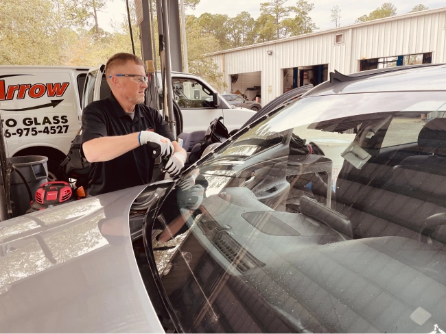 Community Auto Glass Repair technician repairing a windshield